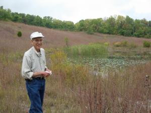 Bro. Don Geiger standing in the prairie that bears his name.